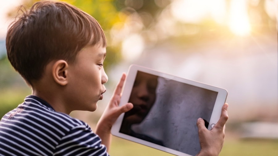 A child using a tablet.